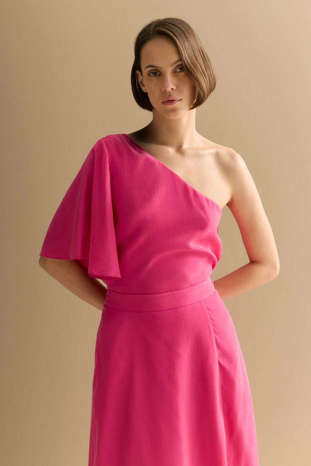 Asymmetric Sleeve Draped Top